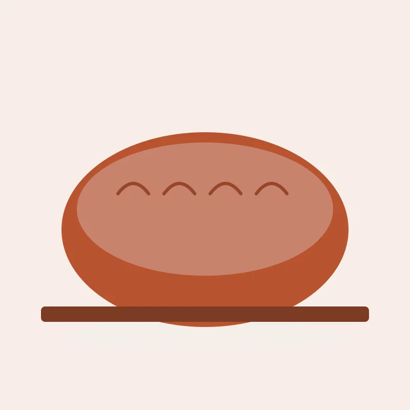 A round loaf with four scores across the crust, on a board