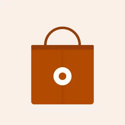 A tote bag in burnt orange with a round white badge